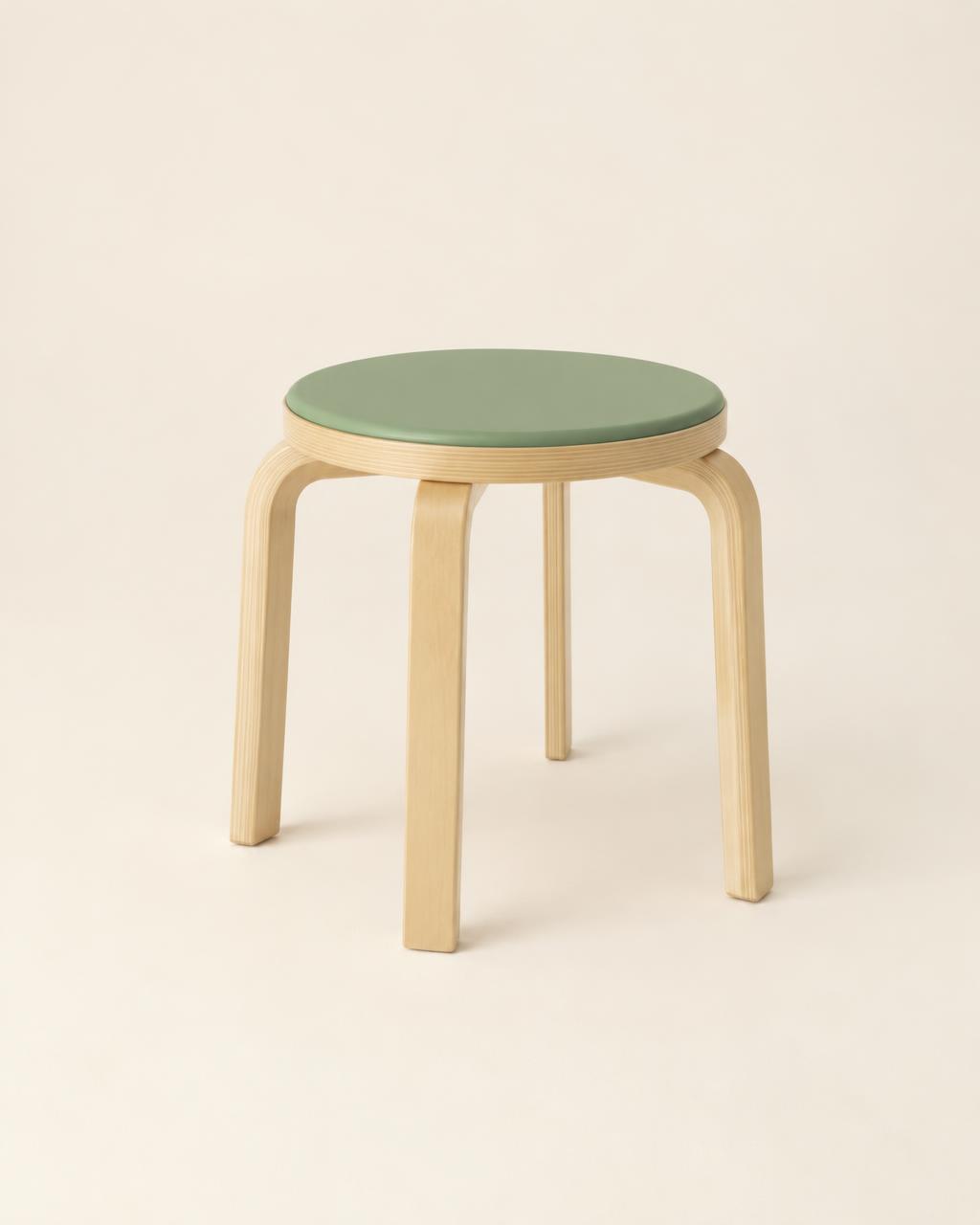 Small birch stool with a sage-green round seat on an ivory backdrop